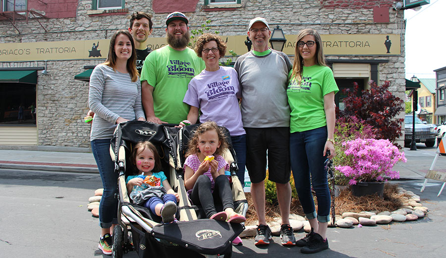 Families and local business owners and artists participating in the cultural arts day 'Village In Bloom'