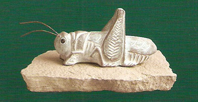 Small 'Grasshopper' sculpture in green finish.