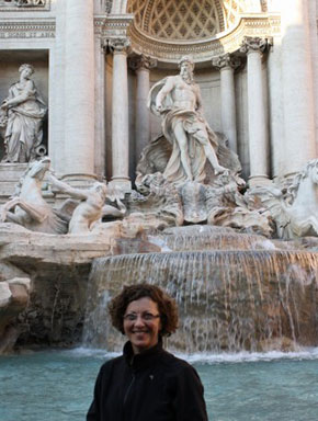 Artist Donna in front of fountains in Europe.