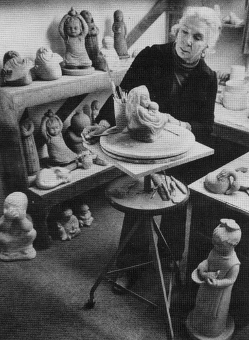 Isabel Bloom in her studio creating a concrete sculpture