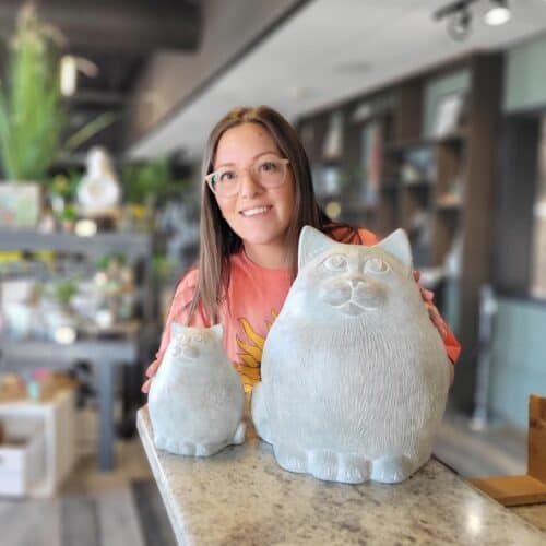 Emma with Fat Cat sculptures